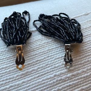 Women’s earrings in a black beaded  cluster of  beads